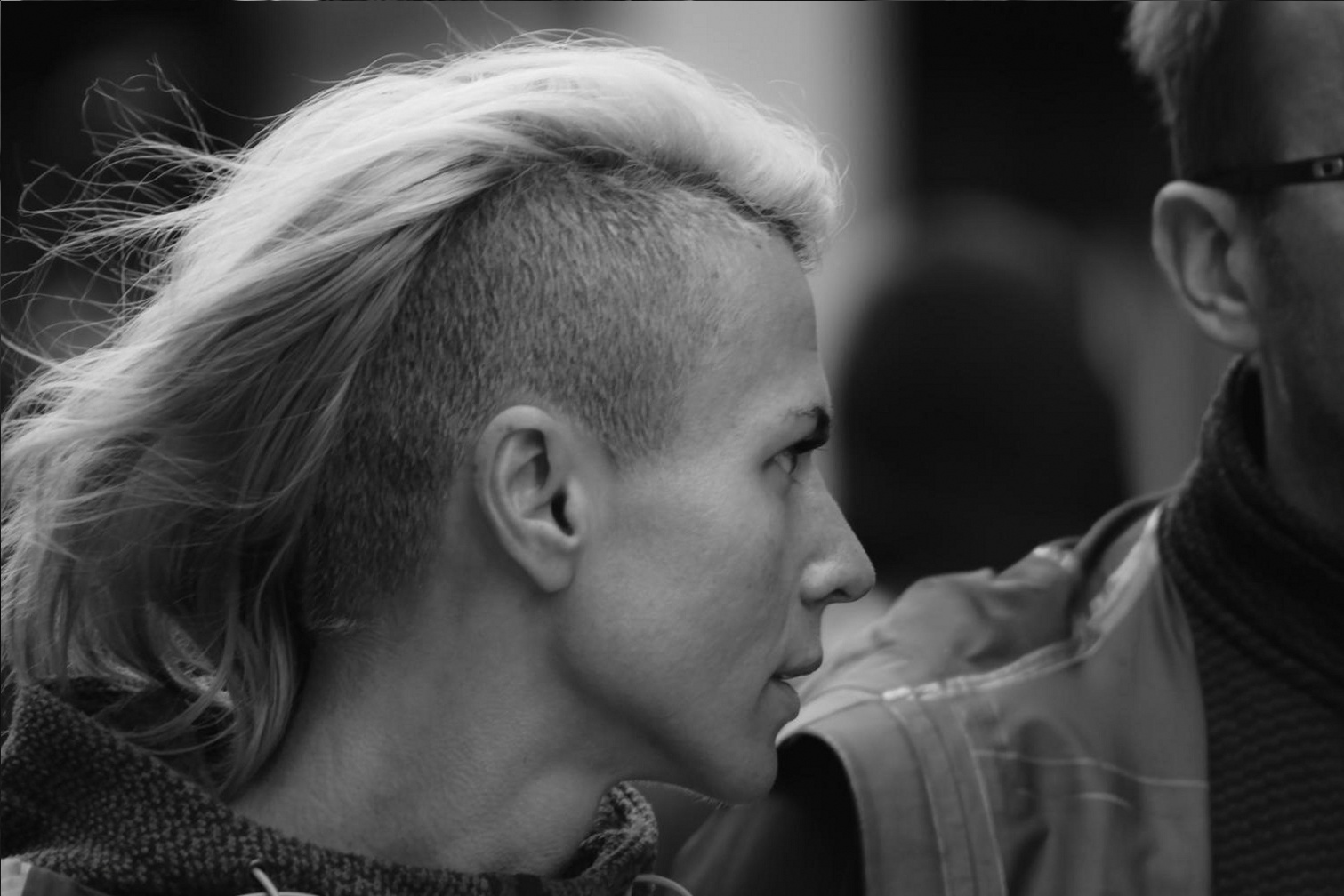 Close-up of precise scissor work during an advanced haircutting session